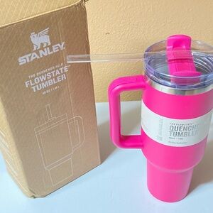 Stanley 40oz pink and silver quencher tumbler with lid and straw.